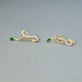 Stone and Strand 14K Yellow Gold Bow Nouveau Diamond and Emerald Gala Earrings Editorial Image