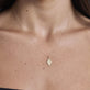 Image of 10K Yellow Gold Diamond Hamsa Necklace on Models Neck