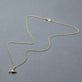 Stone and Strand 10K Yellow Gold Dirty and Flirty Martini Emerald Necklace Editorial Image