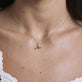 Image of 10K Yellow Gold Dirty and Flirty Martini Necklace with Emerald on Models Neck