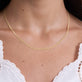 Image of 14K Yellow Gold Flat Arrow Chain Necklace on Models Neck