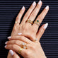 Model wearing Bold Merge Ring with solid gold Stone and Strand jewelry