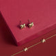 Still life image of Golden Kisses Studs with Stone and Strand solid gold jewelry