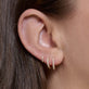 Image of 14K Yellow Gold Lab-Created Diamond Huggie Trio on Models Ear