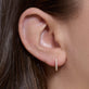 Image of 14K Yellow Gold Lab-Created Diamond Huggies on Models Ear