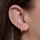 Image of 14K Yellow Gold Lab-Created Second Hole Huggies on Models Ear