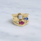 Still life image of Ruby Bonbon Merge Ring with Stone and Strand solid gold jewelry