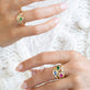 Model wearing Bold Merge Ring with solid gold Stone and Strand jewelry