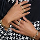 Model wearing Cher Ring with solid gold Stone and Strand jewelry