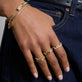 Model wearing Liquid Gold Stretch Bracelet with solid gold Stone and Strand jewelry