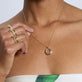 Model wearing Bold Merge Ring with solid gold Stone and Strand jewelry