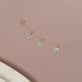 Still life image of Hebrew Mother's Day Charm with Stone and Strand solid gold jewelry