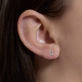 Image of 10K Yellow Gold Pave Diamond Initial Stud on Models Ear