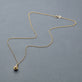 Stone and Strand 10K Yellow Gold Pickle Baller Necklace Editorial Image