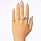 Model wearing Bold Merge Ring with solid gold Stone and Strand jewelry