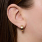 Image of 14K Yellow Gold Slim Gold Glider Huggies on Models Ear