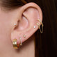 Image of 14K Yellow Gold Slim Gold Glider Huggies with Stone and Strand Earrings