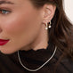 Model wearing Lab-Created Diamond Drop Earrings with solid gold Stone and Strand jewelry