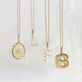 Still life image of Pave Varsity Initial Necklace with Stone and Strand solid gold jewelry