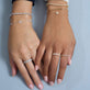 Model wearing Dainty Paperclip Bracelet with solid gold Stone and Strand jewelry