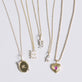 Still life image of Pearly Initial Necklace with Stone and Strand solid gold jewelry