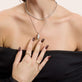 Model wearing Heart of the Matter Pinky Signet with solid gold Stone and Strand jewelry