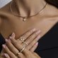 Model wearing The Janet Ring with solid gold Stone and Strand jewelry