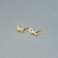 Stone and Strand 10K Yellow Gold Teeny Gold Bow Studs Editorial Image