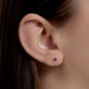 Image of 14K Yellow Gold Tiny Birthstone Earring with Amethyst on Models Ear