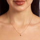 Image of 14K Yellow Gold Tiny Green Goddess Diamond Necklace with Emerald on Models Neck