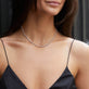 Image of 14K White Gold Unflippable Tennis Necklace In White Gold on Models Neck