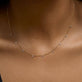 Image of 14K Yellow Gold Teeny Dangling Diamond Bead Chain Necklace on Models Neck